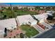 Stunning aerial view of single-story home on a lush green golf course community at 5508 Lochmor Ave, Las Vegas, NV 89130