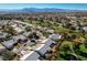 Panoramic aerial view of the community, showcasing golf courses and mountain views at 5508 Lochmor Ave, Las Vegas, NV 89130