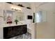 Bright bathroom featuring a dual sink vanity, a soaking tub, and a separate glass enclosed shower at 5508 Lochmor Ave, Las Vegas, NV 89130