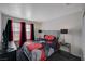 Cozy bedroom with a comfortable bed, side tables with lamps, and bright windows at 5508 Lochmor Ave, Las Vegas, NV 89130
