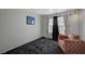 Cozy bedroom featuring a plush armchair and neutral decor at 5508 Lochmor Ave, Las Vegas, NV 89130
