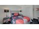 Comfortable bedroom with a gray headboard, closet, two end tables and side lamps at 5508 Lochmor Ave, Las Vegas, NV 89130