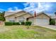 Inviting single-story home featuring a well-maintained lawn and attached garage at 5508 Lochmor Ave, Las Vegas, NV 89130