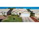 Charming single story home with a manicured lawn and two car garage at 5508 Lochmor Ave, Las Vegas, NV 89130