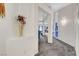 Hallway view with neutral carpet, white walls and art decorations at 5508 Lochmor Ave, Las Vegas, NV 89130