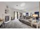 Comfortable living room featuring fireplace and high ceilings with lots of natural light at 5508 Lochmor Ave, Las Vegas, NV 89130