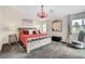 Comfortable main bedroom with a decorative chandelier and neutral color palette at 5508 Lochmor Ave, Las Vegas, NV 89130