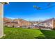 Backyard featuring artificial turf and mountain views at 56 Tatahatso Point St, Henderson, NV 89011