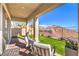 Enjoy this outdoor living space with pavers, low-maintenance turf, and mountain views at 56 Tatahatso Point St, Henderson, NV 89011