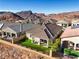 Features landscaped backyard with desert views at 56 Tatahatso Point St, Henderson, NV 89011