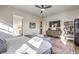 Spacious primary bedroom featuring a TV, shelving, and access to the Primary bath at 56 Tatahatso Point St, Henderson, NV 89011
