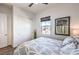 Bright bedroom features a ceiling fan, closet and a window offering natural light at 56 Tatahatso Point St, Henderson, NV 89011