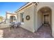 A cozy front porch includes seating and an arched entryway at 56 Tatahatso Point St, Henderson, NV 89011