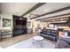 Open-concept living space featuring a fireplace, comfortable seating, and a seamless flow into the kitchen at 56 Tatahatso Point St, Henderson, NV 89011