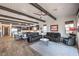 Expansive living room offering seamless open-concept living and dining with comfortable seating and wood-look floors at 56 Tatahatso Point St, Henderson, NV 89011