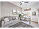 Well-lit home office featuring a comfortable sofa, modern desk, and stylish decor at 56 Tatahatso Point St, Henderson, NV 89011