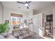 Bright home office with a modern desk setup, decorative accents, and ample natural light at 56 Tatahatso Point St, Henderson, NV 89011
