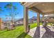 Covered patio with desert landscaping and mountain views, perfect for outdoor living and entertaining at 56 Tatahatso Point St, Henderson, NV 89011