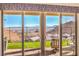 Outdoor view from patio sliding glass door revealing landscaping, patio seating, and mountain views at 56 Tatahatso Point St, Henderson, NV 89011