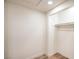 Walk-in closet with hardwood floors offering ample storage space at 5629 Caladonia Ave, Las Vegas, NV 89110