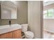 Stylish powder room features a modern vanity, sleek faucet, and a neutral color palette at 5629 Caladonia Ave, Las Vegas, NV 89110