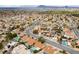 Expansive aerial view showcases a thriving residential neighborhood with community pools and lush landscaping at 619 Ancient Mayan Dr, Henderson, NV 89015