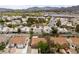 Scenic aerial view of homes with well-manicured lawns, mature trees, and desirable neighborhood appeal at 619 Ancient Mayan Dr, Henderson, NV 89015