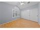 Bedroom featuring plantation shutters, wood floors, ceiling fan, and closet at 619 Ancient Mayan Dr, Henderson, NV 89015