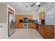 Well-equipped kitchen with stainless steel appliances, custom cabinetry, and ample counter space for cooking at 619 Ancient Mayan Dr, Henderson, NV 89015