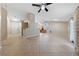 Spacious living room with tile flooring, neutral paint, and lots of natural light from sliding glass doors at 619 Ancient Mayan Dr, Henderson, NV 89015