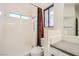 Bathroom features a walk-in shower, toilet, and large window at 6225 Sadler Dr, Las Vegas, NV 89130