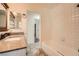 Bathroom with a tiled tub and shower combination and a granite vanity at 6225 Sadler Dr, Las Vegas, NV 89130