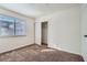 Bedroom showcases a window, carpeted floors, and a closet for storage at 6225 Sadler Dr, Las Vegas, NV 89130