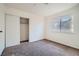 Bright bedroom with neutral carpet and a large window for plenty of natural light at 6225 Sadler Dr, Las Vegas, NV 89130