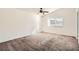 Bright bedroom features carpeted flooring and a window for natural light at 6225 Sadler Dr, Las Vegas, NV 89130