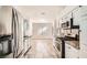 Modern kitchen with stainless steel appliances, granite countertops, and white cabinets at 6225 Sadler Dr, Las Vegas, NV 89130
