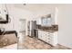 Well-lit kitchen featuring stainless steel appliances, and tile flooring at 6225 Sadler Dr, Las Vegas, NV 89130