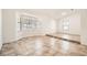 Bright living room with ceramic tile flooring, neutral paint, and a large bay window for ample natural light at 6225 Sadler Dr, Las Vegas, NV 89130