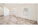 Open-concept living room with large windows and neutral colors creating a bright and airy space at 6225 Sadler Dr, Las Vegas, NV 89130