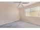 Comfortable bedroom featuring neutral walls, a ceiling fan, and a window with blinds at 6365 Diego Dr, Las Vegas, NV 89156
