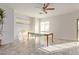 Sunlit dining area with tile floors, a ceiling fan, and bright sunlight at 6365 Diego Dr, Las Vegas, NV 89156