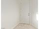 Clean entryway featuring a white door, light tile flooring, and neutral wall color at 6365 Diego Dr, Las Vegas, NV 89156