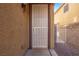 Close-up of a security door with a beige exterior and access to the side yard at 6365 Diego Dr, Las Vegas, NV 89156