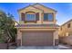 Charming two-story home featuring a two-car garage and a well-maintained front yard with desert landscaping at 6365 Diego Dr, Las Vegas, NV 89156
