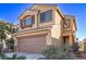 Charming two-story home with a two-car garage and desert landscaping enhancing curb appeal at 6365 Diego Dr, Las Vegas, NV 89156