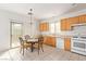 Well-lit kitchen and breakfast nook with sliding glass door access to the backyard at 6365 Diego Dr, Las Vegas, NV 89156