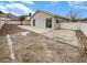 The backyard features a concrete patio, block fence, and mountain views at 6412 Dallaswood Ln, Las Vegas, NV 89156