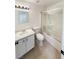 Clean bathroom with a shower and tub, a vanity, and a neutral color scheme at 6412 Dallaswood Ln, Las Vegas, NV 89156