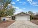 Charming single-story home featuring a two-car garage, neutral paint, and desert landscaping for easy maintenance at 6412 Dallaswood Ln, Las Vegas, NV 89156