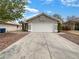 Charming single-story home featuring a two-car garage, neutral paint, and desert landscaping for easy maintenance at 6412 Dallaswood Ln, Las Vegas, NV 89156